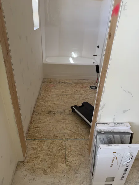 Preparation continues through the passage between rooms.