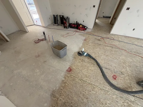 Equipment is on site as the exposed floor is prepared for its next finish.