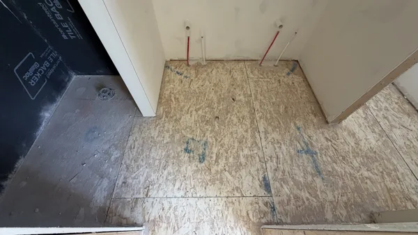 A close view of the exposed floor at a doorway.
