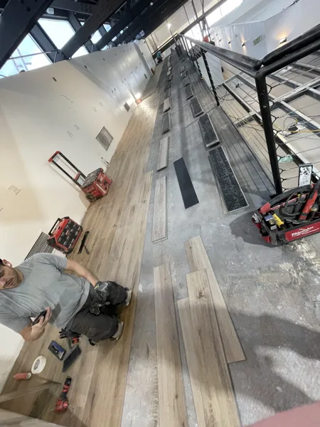A view of the LVP installation work, finished areas or flooring details at The Beauty Stop.