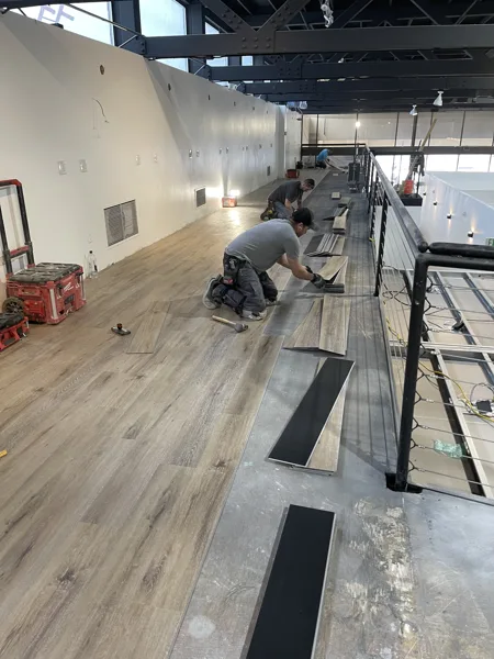 A view of the LVP installation work, finished areas or flooring details at The Beauty Stop.