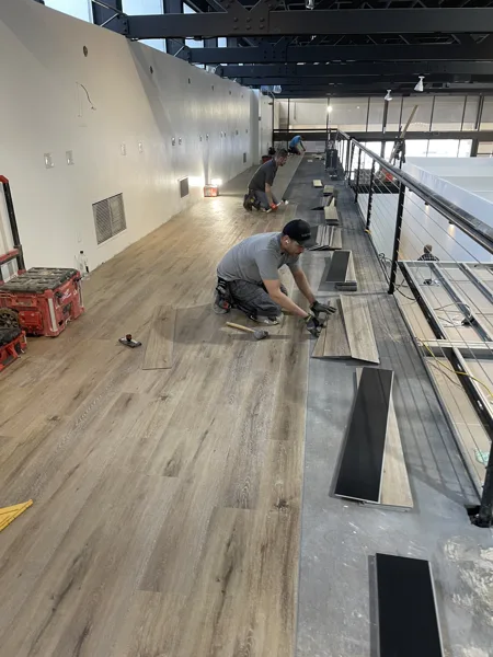 A view of the LVP installation work, finished areas or flooring details at The Beauty Stop.