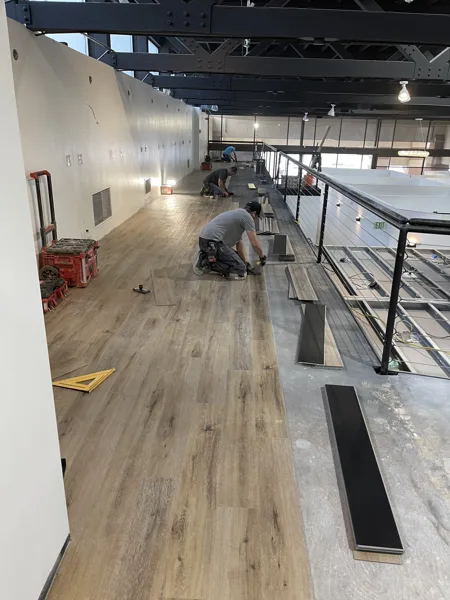 A view of the LVP installation work, finished areas or flooring details at The Beauty Stop.