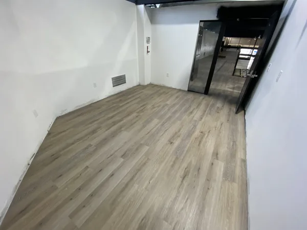 A view of the LVP installation work, finished areas or flooring details at The Beauty Stop.