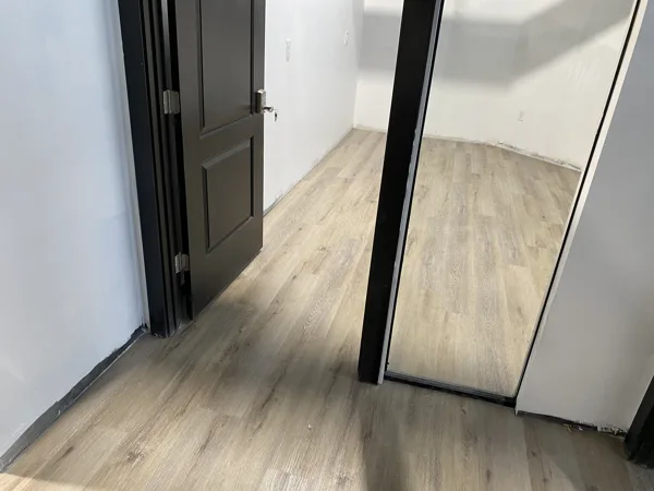 A view of the LVP installation work, finished areas or flooring details at The Beauty Stop.
