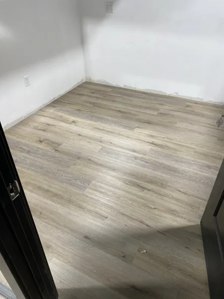 A view of the LVP installation work, finished areas or flooring details at The Beauty Stop.