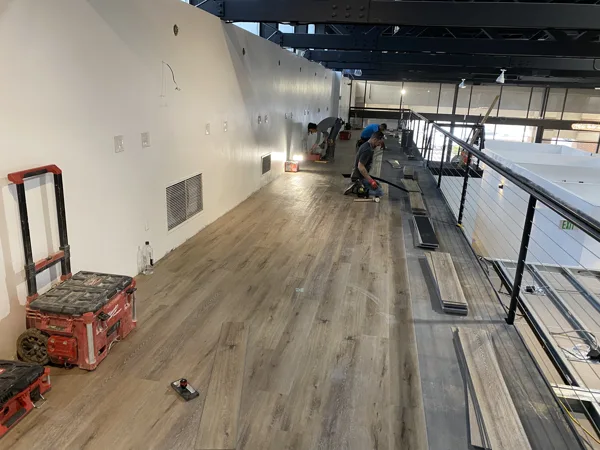 A view of the LVP installation work, finished areas or flooring details at The Beauty Stop.