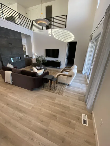 A view of the laminate floor in the sunlit living space.