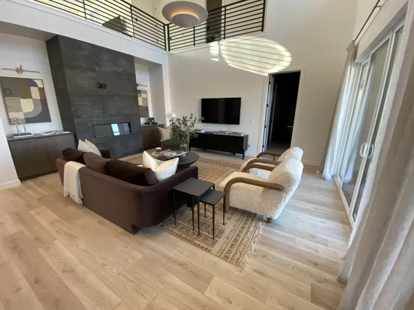 The wood-look floor under the seating area and dining table.