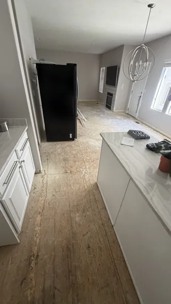 Plank flooring through the kitchen and adjoining living space.