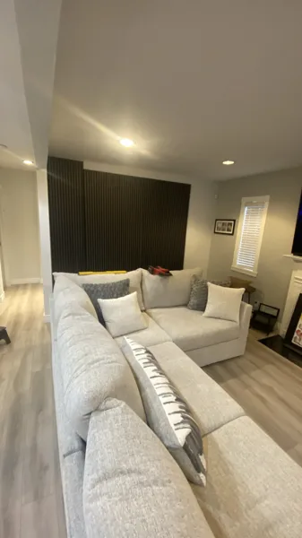Wood-look plank flooring through the bungalow’s living area and adjoining kitchen.