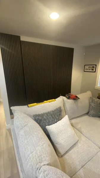 Wood-look plank flooring through the bungalow’s living area and adjoining kitchen.